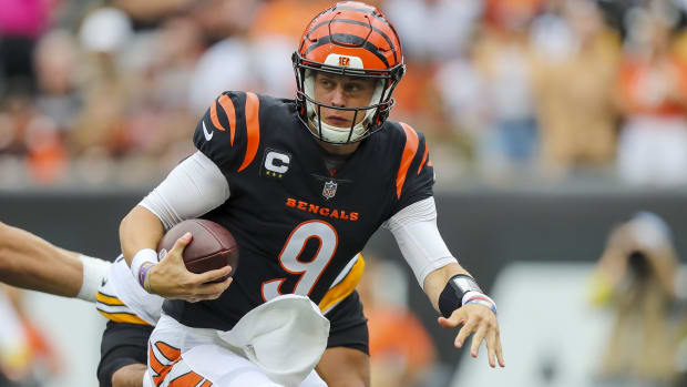 Sep 11, 2022; Cincinnati, Ohio, USA; Cincinnati Bengals quarterback Joe Burrow (9) runs with the ball against the Pittsburgh Steelers in the first half at Paycor Stadium. Mandatory Credit: Katie Stratman-USA TODAY Sports
